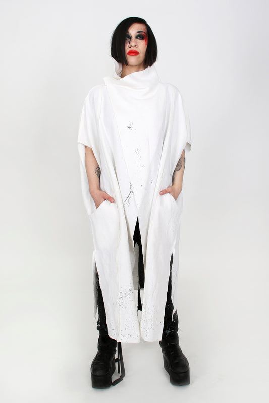 ZHANNAONA cape coat white linen painted with organic textile paint minimalist genderfluid unisex Barcelona avant-garde fashion